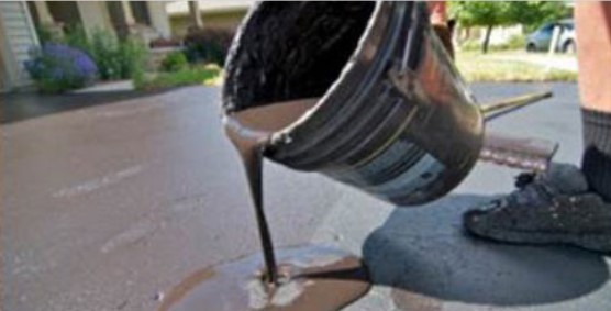 pciture of sealant poured from a bucket